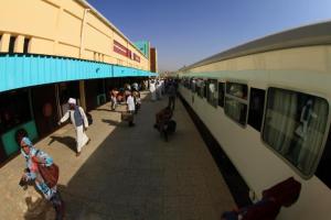 Passengers walk down the platform to get on the new Nile Train in Khartoum (Photo/Ashraf Shazly)